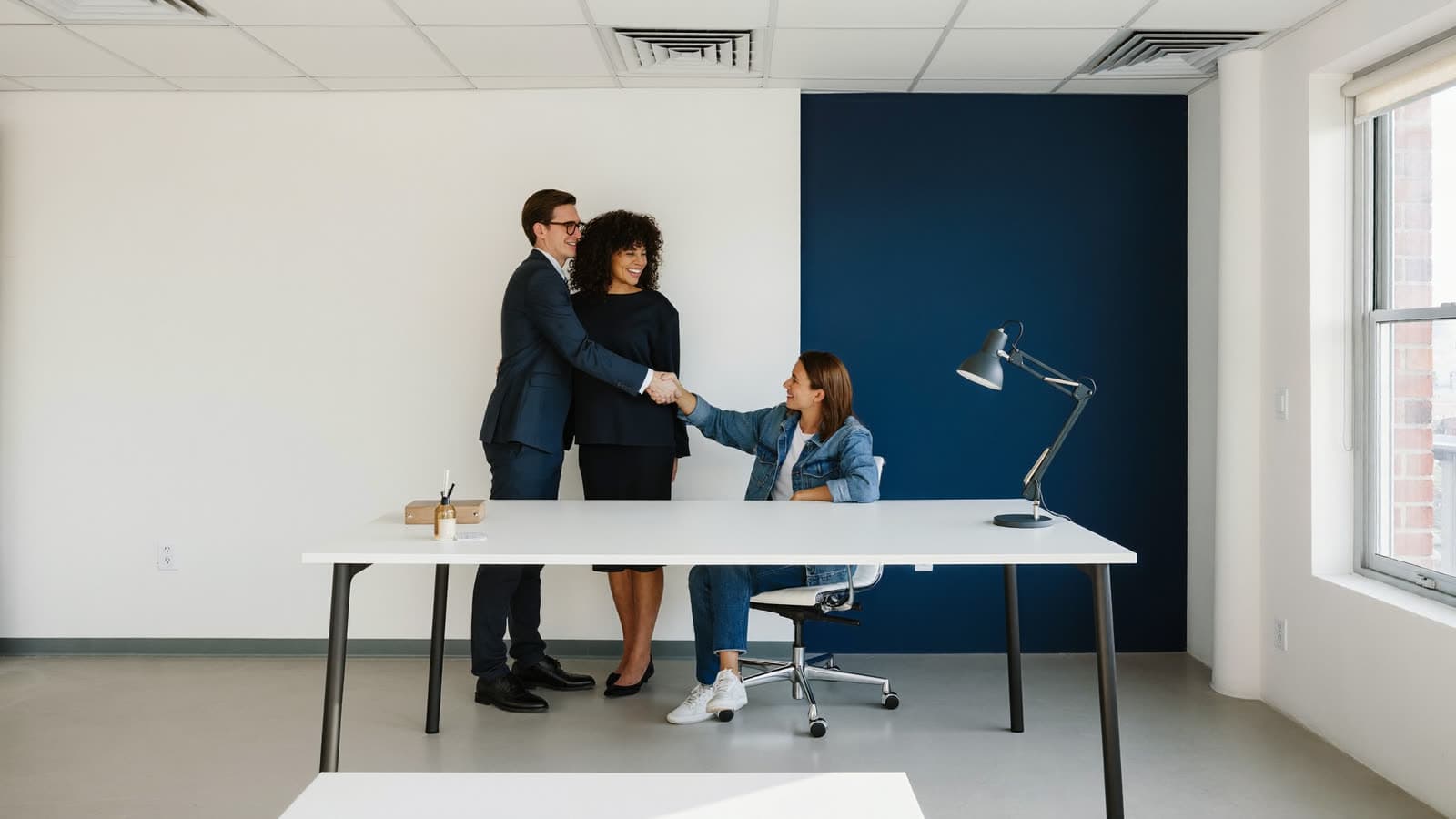 A licensed advisor shaking hands with a satisfied member